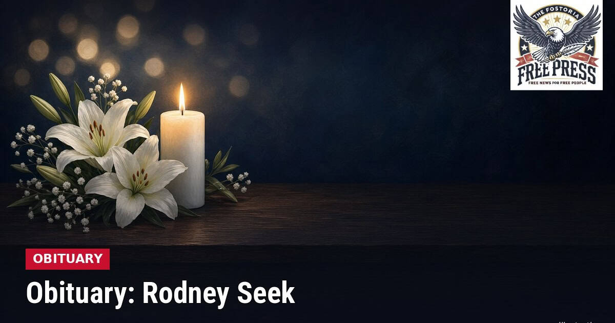 Fostoria News Memorial candle and lilies for Rodney Seek obituary in Fostoria.